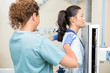 © Tyler Olson - Nurse Preparing Patient For Chest Xray