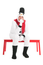 Human Snowman Sitting On Bench