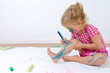 © Ozgur Coskun - Cute Toddler Painting Her Legs Carefully