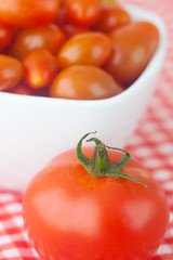 Wall Mural - cherry tomatos and tomatos in bowl on checkered fabric