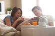 © stokkete - Couple having breakfast in bed