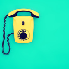 Yellow Retro Telephone On A Blue Background