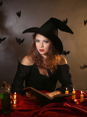 Halloween witch on dark background