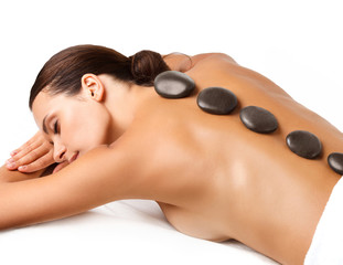 Wall Mural - Stone Massage. Beautiful Woman Getting Spa Hot Stones Massage