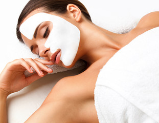 Wall Mural - Beautiful Woman Getting Spa Treatment. Cosmetic Mask on Face.