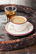 Coffee laced with brandy on dark background