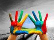 © Photocreo Bednarek - Painted colorful hands showing way to colorful happy life