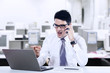 © Creativa Images - Angry businessman at the phone