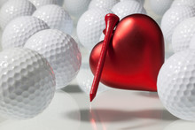 Many Golf Balls And Red Heart