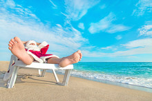 Sunbathing Santa Claus Relaxing In Bedstone On Beach - Christmas