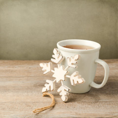 Wall Mural - Cup of tea with Christmas decoration snowflake