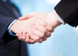 © stockyimages - Successful businessmen shaking hands