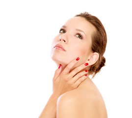 A young woman touching her face, closeup