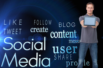 Poster - Composite image of young man showing screen of his tablet comput