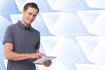 Poster - Composite image of smiling young man with tablet computer