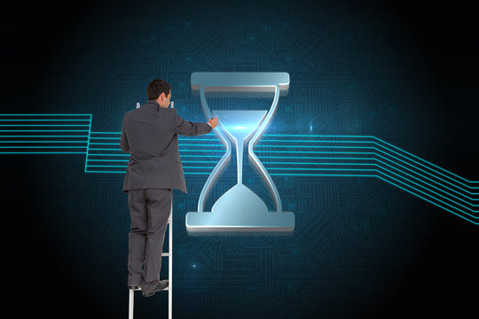 Composite image of businessman standing on ladder