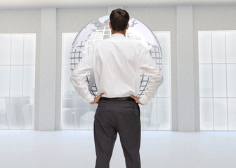 Poster - Composite image of rear view of classy young businessman posing