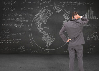 Poster - Composite image of young businessman standing back to camera scr