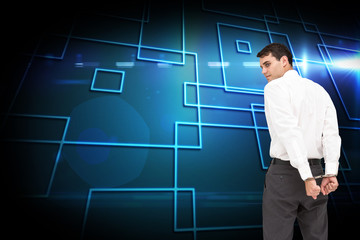 Poster - Composite image of businessman wearing handcuffs