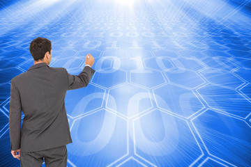 Poster - Composite image of businessman standing back to camera writing w