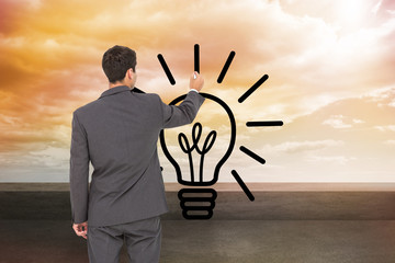 Poster - Composite image of businessman standing back to camera writing w