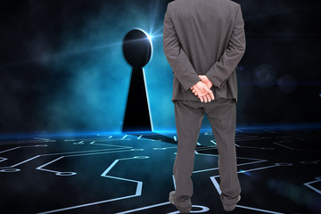 Poster - Composite image of rear view of classy businessman posing