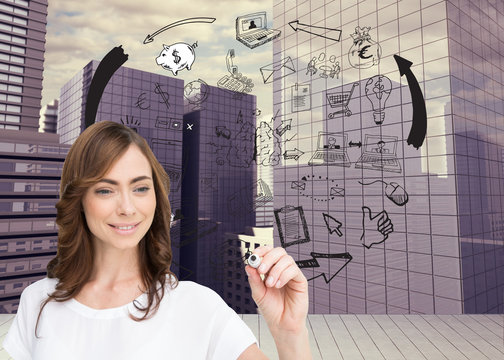 Composite image of smiling businesswoman holding marker