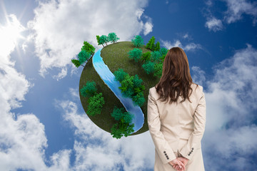 Poster - Composite image of rear view of businesswoman