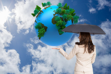 Poster - Composite image of elegant businesswoman holding black umbrella
