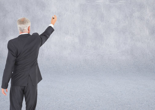 Composite image of rear view of serious businessman standing and