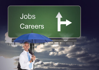 Poster - Composite image of businessman holding umbrella smiling at camer