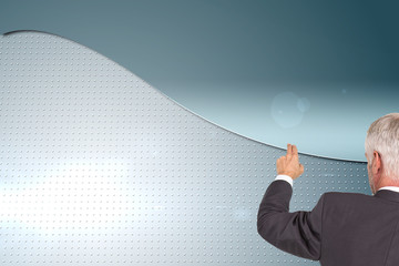 Poster - Composite image of rear view of stylish mature businessman point