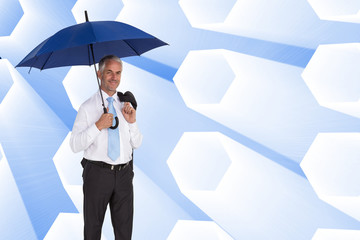 Poster - Composite image of happy businessman holding umbrella
