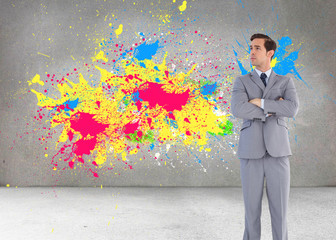 Poster - Composite image of serious businessman with arms crossed