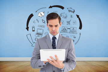 Poster - Composite image of businessman holding a tablet computer