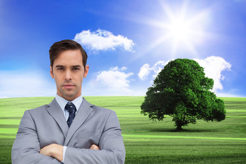 Poster - Composite image of young businessman looking at camera