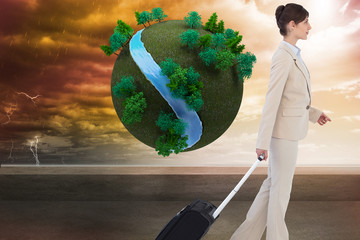 Poster - Composite image of serious businesswoman pulling suitcase