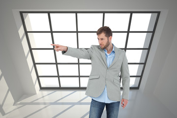 Poster - Composite image of trendy model pointing to something