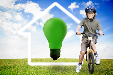 Poster - Composite image of little boy with his bike in a park