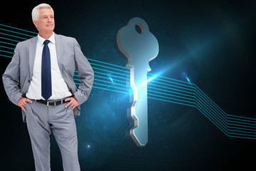 Poster - Composite image of man in a suit with his hands on his hips