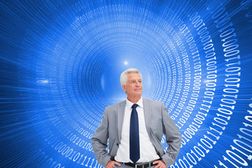 Poster - Composite image of man in a suit with his hands on his hips