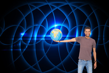 Poster - Composite image of handsome man holding out a globe