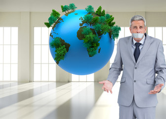 Poster - Composite image of businessman gagged with adhesive tape on mout