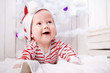 © golovianko - Smiling baby with the Christmas decorations