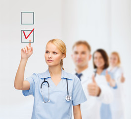 Sticker - smiling doctor or nurse pointing to checkmark