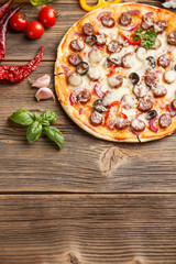 Canvas Print - Pizza on old wooden board