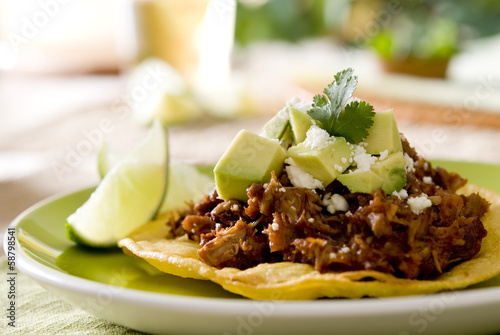 Fotografie, Obraz tostada topped with shredded pork, feta and vegetables.