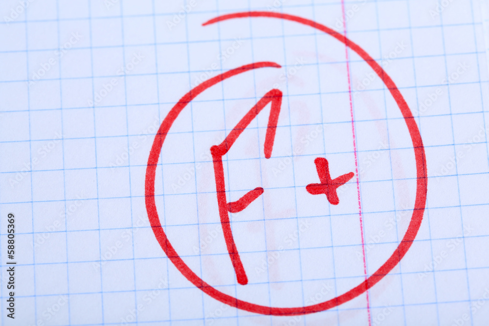 Grade F written on an exam paper