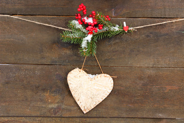 Wall Mural - Decorative heart on rope, on wooden background