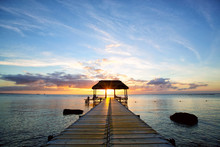 Jetty Silhouette Against Beautiful Sunset In Mauritius Island